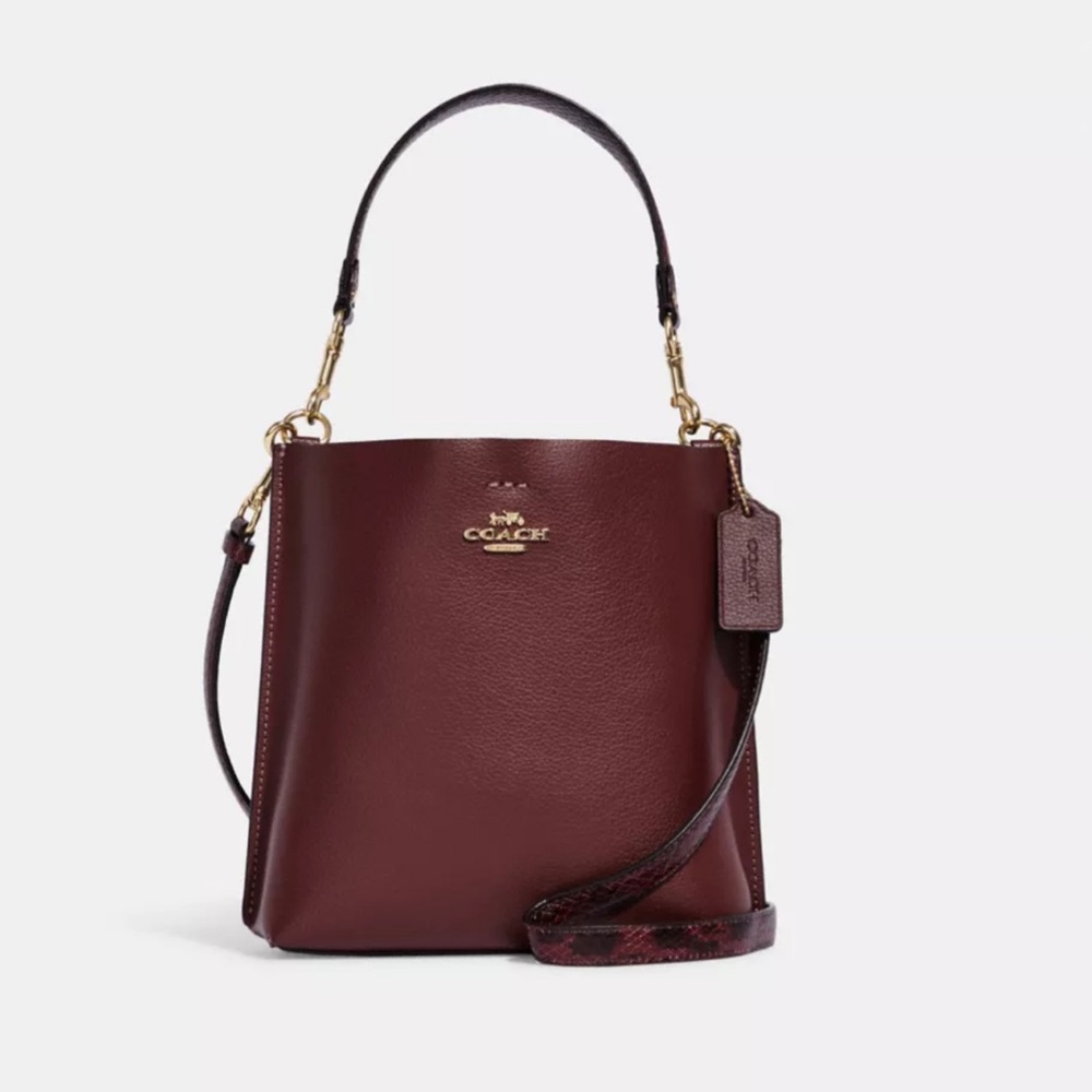 Coach Mollie Bucket Bag 22 in wine color with snake print strap